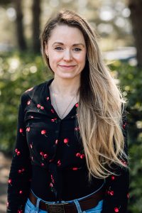 Blonde female content writer looking at the camera