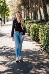 Blonde female content writer walking towards the camera