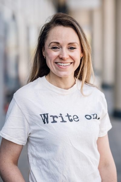Photo of a blog copywriter wearing a "write on" t-shirt